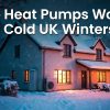 Snowy UK house with an outdoor heat pump in winter, with text "Do Heat Pumps Work in Cold UK Winters?"